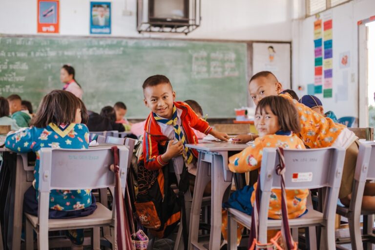 elementary school students happily learning Spanish in a classroom setting